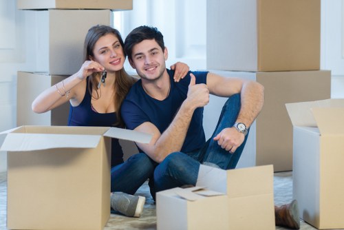 Moving team using safe lifting practices during a man and van service