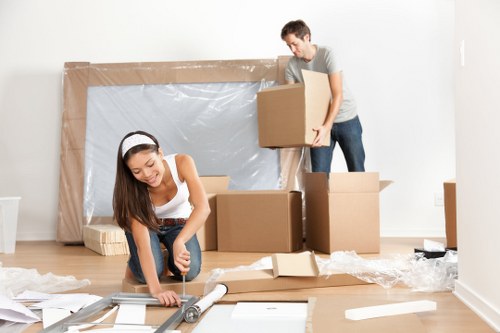 Removal team planning a flat move on a Hampstead residential street
