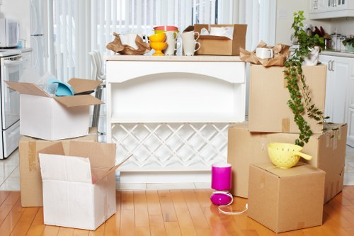 Packed moving boxes and furniture prepared for transport in Hampstead