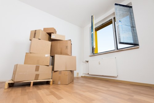 Careful wrapping of fragile household items during packing services in Hampstead