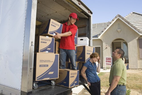 Packed moving boxes and furniture prepared for removal service